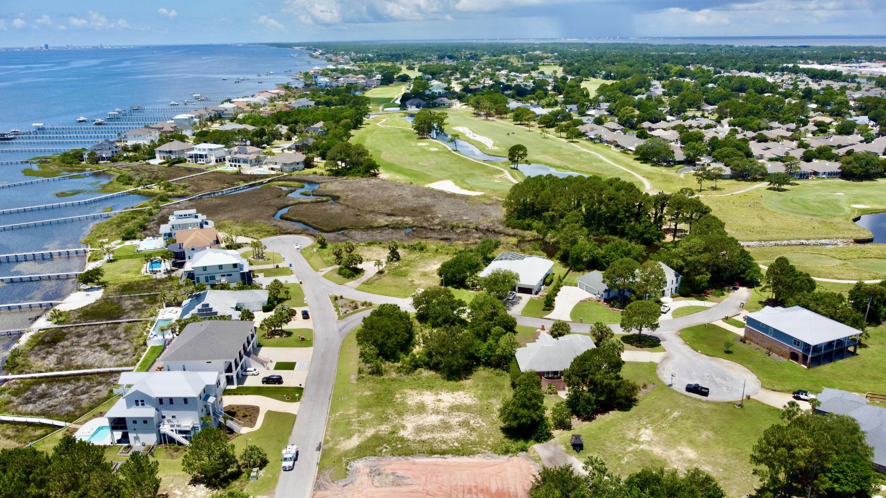 If you are looking for the perfect piece of property to build your dream home, this is it! This amazing property is located on a corner lot in the highly sought out Tiger Point Subdivision offering beautiful views of the Santa Rosa Sound and the Tiger Point Golf Course. Tiger Point is a golf cart friendly community so hop on your golf cart and head over to The Pointe where you can have a delicious meal over looking the golf course. The gorgeous white sand and emerald waters of Pensacola Beach are only 10 miles away. There are only a few vacant lots left, you don't want to miss out, especially on this one!