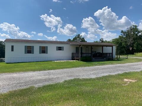 21.28 acres in country setting with plenty of elbow room to have your own hobby farm. Everything in place including fencing, 5 pole barns, pastures, and roping arena. Whether you have horses or cows, this property is setup and ready for you to enjoy. Well maintained mobile home is 16x76 with split floor plan. Garden tub and shower in master bath. Covered front porch. Note: Mobile home has been moved more than once. 24x36 workshop with electric and roll up door, RV connection behind mobile home. 40x80 horse barn with 5 stalls, tack room & lean to on side. There are 5 pole barns & utility building on property. Additional well and electric at roping pen at rear of property. Wet weather stream and wooded area. The hard work has been done. Come see this one before it gets away!