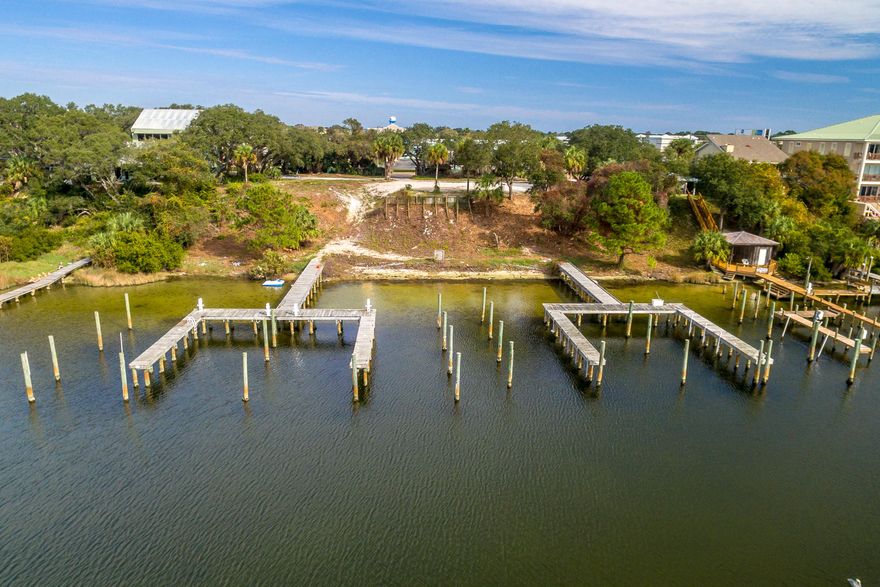 SIGNIFICANT PRICE REDUCTION!! One of four contiguous lots available for new construction, perched upon a stunning elevation, which enjoys a scenic vista across Destin, Florida's coveted Harbor, admiring breathtaking views of the East Pass and Gulf of Mexico! Such convenient access with unprecedented views is a rare and unique opportunity to debut new construction on one or all of the contiguous (4) lots that are available, each measuring approximately 50' x 219', containing a total of (8) deep-water boat slips! (two slips per lot) The site is zoned Low Density Residential-Harbor (LDR-H); Property Survey/Dock Illustration uploaded under Documents Tab. Buyer must verify all information and specifications.