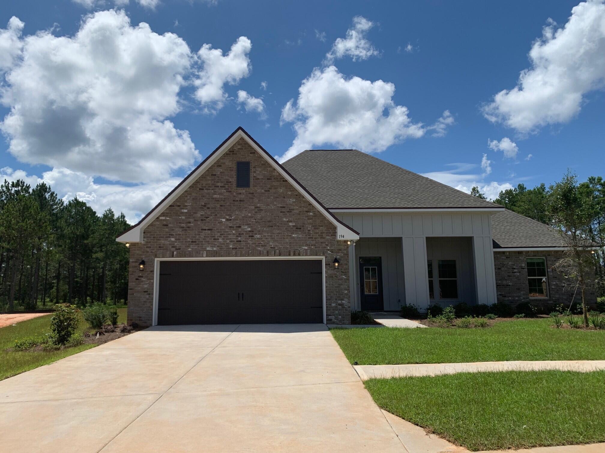 The JOHNSON IV G in The Trails at Hammock Bay community offers a 4 bed, 3 full bath, open and split design with a formal dining room, separate breakfast area, and a pocket office. Upgrades added (list attached).Special Features: double vanity, garden tub, separate tiled shower, and walk-in closet in master bath, master closet goes through to laundry, boot bench and drop zone in mud room, double vanity in 2nd bath, walk-in closets, built-in desk in the office, kitchen island, walk-in pantry, covered porch and patio, recessed lights, bronze plumbing fixtures, framed mirrors, smoke/carbon monoxide detectors, landscaping, architectural 30-year shingles, and more!Energy Efficient Features: tankless gas water heater, kitchen appliance package with gas range, low E MI windows, and more!