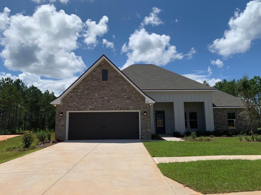 The JOHNSON IV G in The Trails at Hammock Bay community offers a 4 bed, 3 full bath, open and split design with a formal dining room, separate breakfast area, and a pocket office. Upgrades added (list attached).Special Features: double vanity, garden tub, separate tiled shower, and walk-in closet in master bath, master closet goes through to laundry, boot bench and drop zone in mud room, double vanity in 2nd bath, walk-in closets, built-in desk in the office, kitchen island, walk-in pantry, covered porch and patio, recessed lights, bronze plumbing fixtures, framed mirrors, smoke/carbon monoxide detectors, landscaping, architectural 30-year shingles, and more!Energy Efficient Features: tankless gas water heater, kitchen appliance package with gas range, low E MI windows, and more!