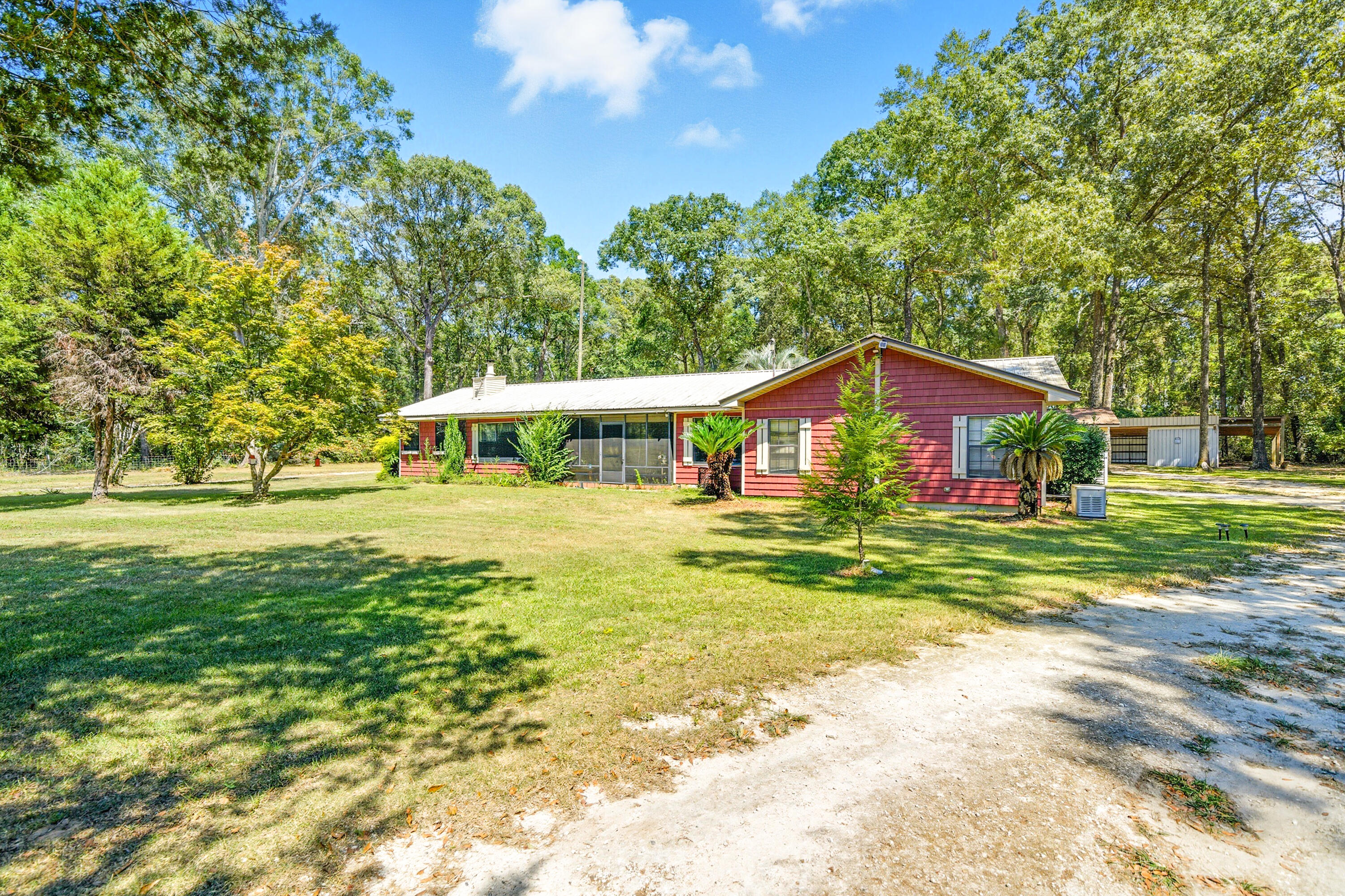 Country living at its greatest on 1.19 +/- acres. Welcome to this beautifully maintained 5 bedroom, 3 bath home located in the quiet area on Highway 0605. Open concept kitchen, large living room, master suite with large walk in closet, private bathroom and hot tub room. Outside features include separate 14x24 office with half bath, pole barn 32x60 with heated/cooled office toilet and overhead storage; small shed; 60x25 shed; large barn for truck or boat. Well pump and electric replaced in 2025.