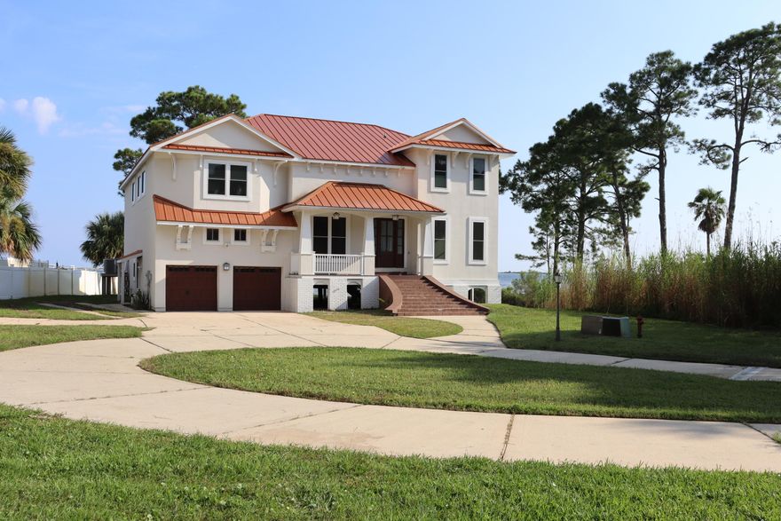 Get ready to fall in love with this stately home located on the Santa Rosa Sound. All 53 windows upgraded and replaced with hurricane windows. Exterior completely stripped and all of the EFIS and insulation updated and replaced.  New Aluminum roof 2022. Enjoy sitting on your beautiful enclosed porch while grilling dinner, looking out over the sound with your boat on your dock, which sports two boat lifts, one is an 18,000 lb lift.. The kitchen has top-of-the-line appliances with exquisite cabinetry.  The living room also offers an unobstructed water view. On the second floor, two endearing Juliet balconies overlook the living room. With five bedrooms, you will probably have enough bedrooms, but if not, there is a bonus room that can be a sixth bedroom with 2 windows and a closet..