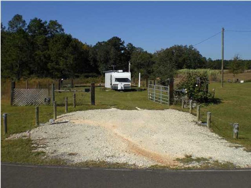 Hunter's Dream with this 3 acre parcel. Property has a power pole and water from the City of Paxton. Owner is open to a creative offer. The picture shows a camper that has been removed from property. Will exchange for other property or provide owner financing for qualified buyer. Listing Broker/Salesperson has equitable interest in the property.