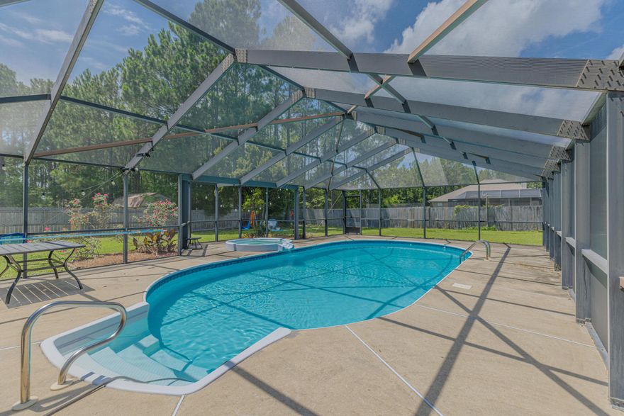 Kick your feet up and watch the family play in your private, screened-in, in-ground pool in this move-in ready home! Located in the sought-after Holleyby the Sea community of Navarre, this 4-bedroom, 3-bath beauty is situated on a generous half-acre fenced lot, which offers privacy but quick accessto the military bases, top-rated schools, and sandy white beaches of the Gulf of Mexico. This home boasts charming features, such as luxury vinyl plank, a foodie's dream kitchen with beautiful white quartz countertops, and a beautiful primary suite with his and her vanities, dual walk-in closets, and a separate soaking tub! This home offers a nearly new roof (2022), hot water heater (2022), new pool pump and filter, new recess lighting in the living room, new pool cage, smart home upgrades.