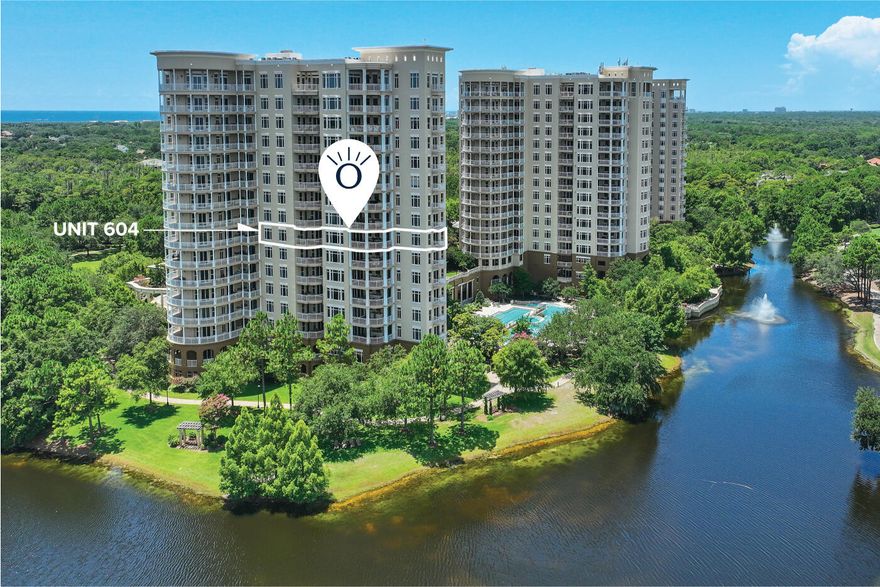 Welcome to Unit 604 at One Water Place - an exquisite Darlington, the most popular floor plan, offering 3 bedrooms, 3.5 bathrooms, and 3,415 square feet of refined living space. Perched on the 6th floor and boasting three private balconies - including one with a built-in summer kitchen - this residence showcases sweeping views of the Choctawhatchee Bay and the lush fairways of Kelly Plantation. Enjoy waking up to spectacular sunrises from any of the three balconies while you sip your coffee an take in the breath taking views of the Bay. From the moment the elevator opens into your private vestibule, you'll sense the thoughtful design and upscale touches that set this home apart. Inside, coffered ceilings, custom millwork, and elegant crown molding create an atmosphere of timeless.... sophistication, while wide-plank wood floors run seamlessly throughout the open living areas. The light-filled great room, anchored by a gas fireplace and flanked by built-in bookcases, flows effortlessly into a formal dining space and a cozy sitting areaperfect for entertaining or unwinding in style. Adjacent to the dining room is a climate-controlled space that can serve as a wine cellar or butler's pantry for entertaining. The fully renovated kitchen is a chef's dream. Outfitted with top-of-the-line Viking appliances and a very quiet Bosch dishwasher and highlighted by quartz countertops, a custom tile backsplash, and a custom pantry, it balances beauty with function. Pendant lights over the counters add visual warmth, and the breakfast nook offers a relaxed spot for casual meals. The owner has thoughtfully added a whole-house water filtration system, filtering out chemicals for healthier cooking, bathing, and laundering. All windows and doors have been professionally sealed recently, resulting in remarkably low utility costs and a tranquil, energy-efficient environment. Every bathroom in the home has been fully renovated, with the master suite standing out as a serene retreat. The spa-like master bath features a freestanding soaking tub, a custom walk-in shower, and custom shelving and cabinetry, which discreetly houses a beverage cooler and hidden safe. The suite opens to its own private terraceperfect for morning coffee with a view of the Bay and Golf Course. The split-bedroom layout ensures privacy for all, with two spacious guest suites each offering their own en-suite bathrooms. The laundry room is equally well-equipped, with a built-in wall-mount ironing board and additional storage space. This condo not only has two secured parking spaces, they're intentionally positioned on the 1st floor near both the elevator and car wash, vacuum, and air station and afford easy ingress and egress even for large trucks or SUVs. One Water Place offers a resort lifestyle with unmatched amenities: a grand clubhouse, full-service Wellness Center with a steam room, dry sauna and a Juice Bar, in addition to a 5,000-square-foot fitness facility, a resort-style pool with waterfalls and both indoor and outdoor hot tubs, movie theater, game room, library, and lighted tennis, bocce, and pickleball courts. Walking trails, Riding Stables, a dog park, a putting green, and the Fred Couples Signature Golf Course round out the offerings in the vibrant Kelly Plantation community. Kelly Plantation is just minutes from the Destin Executive Airport and the Destin-Ft. Walton Beach Airport and there are four grocery stores; along with Lowes and Home Depot all within one mile. Kelly Plantation is less than a mile from the Henderson State Park and its more than 6,500 feet of pristine shoreline. Henderson State Park is an approximately 200 acre parcel, renowned for having some of the whitest sand beaches in the World. For those seeking luxury, convenience, comfort, and a resort lifestyle in one of Destin's most prestigious addresses, 604 One Water Place delivers on every level.
