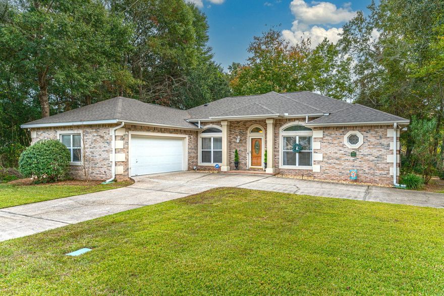 MASSIVE Price Improvement!! Welcome home to this impeccably maintained and updated property in South Crestview's hidden hamlet of Juniper Creek! Gorgeous, towering trees and paved sidewalks set the tone for this established estate neighborhood tucked away off Antioch Road ensuring an easy commute to all local bases and zoned for highly rated Antioch Elementary School. A stately circular drive provides a gracious approach as well as additional off-street parking for this all-brick home situated on a large corner lot. From the covered front entry, find a lovely foyer leading directly to the heart of the home - a grand scale, open concept living, dining, and kitchen space with vaulted ceilings. The gourmet kitchen features all stainless steel appliances including a gas range, NEW refrigerator