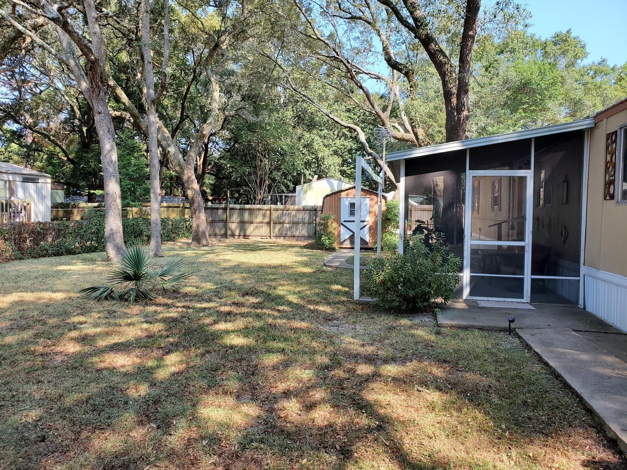 AFFORDABLE HOUSING!!! 2 bedroom, 2 Bath, 896 Sq Ft., manufactured home, and furnished with some exclusions. Screened porch, fully fenced yard and carport. Close to Hurlburt, shopping and dining. Convenient to everything.