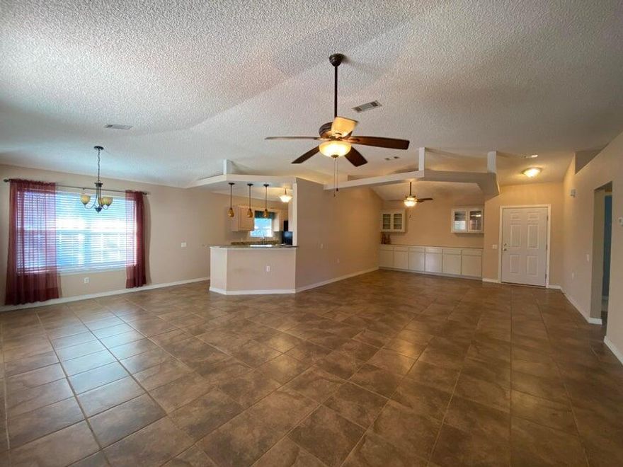 A tastefully 3/2 in Lighthouse Pointe is a must see. Has been a positive income rental since purchased 5 years ago. The kitchen has ample workspace, granite countertops and breakfast bar. Lovely tile in the main living areas, kitchen and baths with carpet in the bedrooms. Spacious primary bedroom with walk-in closet, sitting area and bath has a granite countertop, garden tub and separate shower. Guest bath has tiled walk-in shower and new vanity. The covered patio overlooking the large, fenced backyard. The subdivision comes with sidewalks, underground utilities and deeded sound front access with a pier, beachfront and a picnic area,2 playgrounds. Enjoy these beach amenities without the maintenance. Seller providing home warranty, survey and closing cost assistance. No flood ins. required