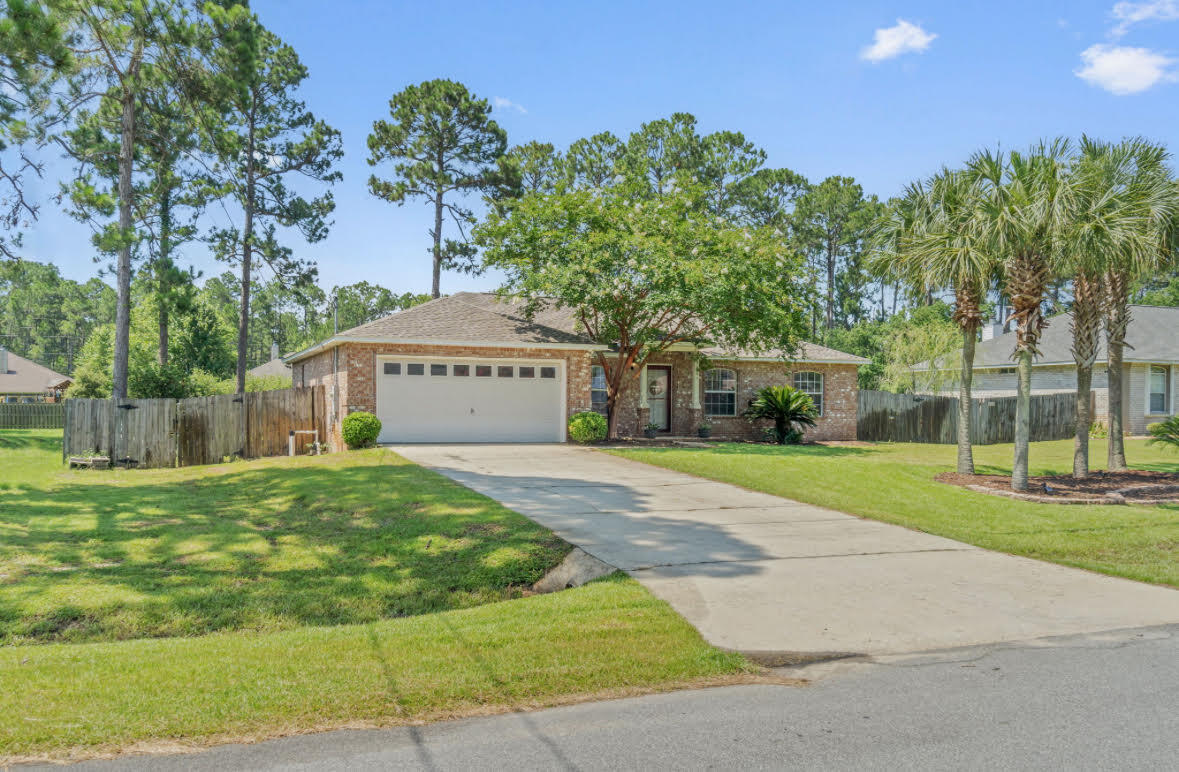 This exceptional ''Dolphin Custom Home'' built in 2004 is an absolute gem. Situated in the sought-after neighborhood of Holley By The Sea, this 4-bedroom, 2-bathroom residence offers the perfect blend of comfort and style. With a new roof installed in 2020, you can enjoy peace of mind knowing that your home is well-protected. The brand new A/C unit, complete with a 10-year warranty, ensures optimal climate control and efficiency. Recent upgrades include a new oven, microwave, backsplash, front storm door and sprinkler system on a well. The high ceilings throughout create a sense of spaciousness and airiness, enhancing the overall appeal of this perfect home.