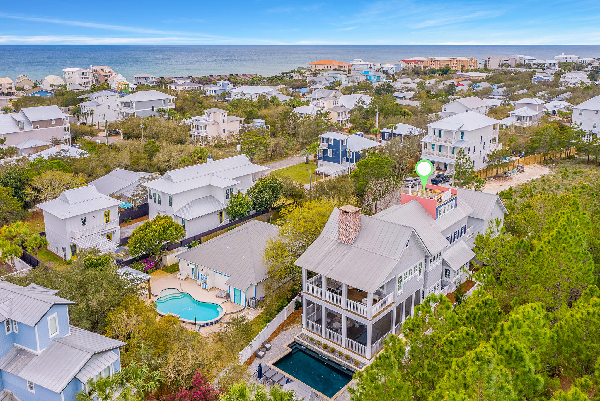 172 A Street is ideally located at the end of a cul-de-sac, with a 175ft wooded buffer which provides a sense of seclusion. This Gambrel-style home is ideally located in the heart of Seacrest, and less than 1,000ft away from deeded beach access. This home features 6 bedrooms, 6 bathrooms, 5,125 square feet, and a private pool. This first floor offers a spacious open plan and features a gourmet kitchen, a beautiful custom breakfast nook and bar, an oversized laundry, complete with custom storage bins and a built-in desk, and a guest suite bedroom with full bath. The second floor features an oversized master suite, which is complete with a spacious bedroom, sitting area, and a wood burning fireplace. The master bathroom features custom flooring, a stand-alone tub, and a walk-in shower.