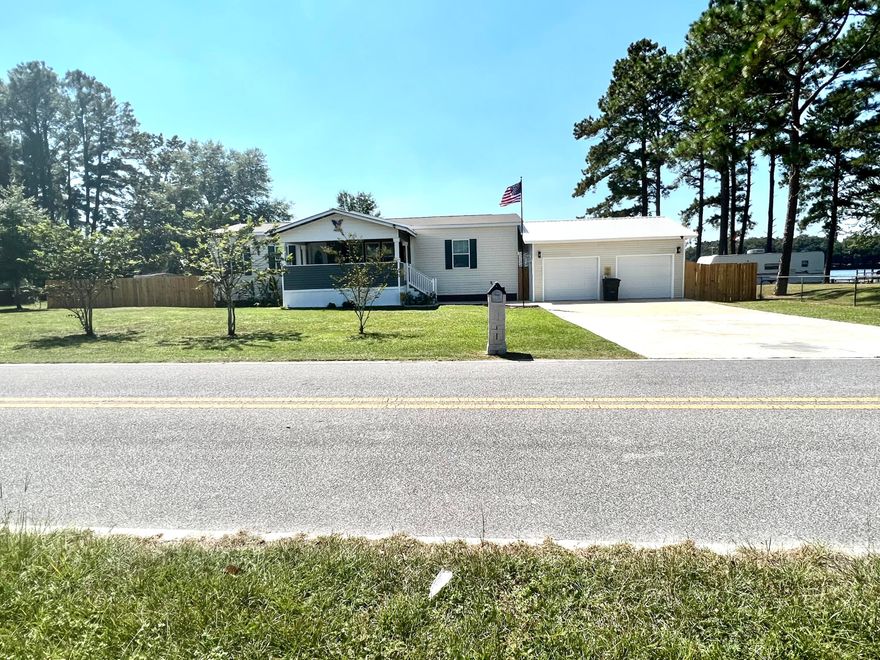 Waterfront home and fisherman's dream location! How would like to have an address:  ''Paradise Island?'' Add this to your list of homes to view.  It has vaulted 9' ceilings,  large walk in closets, upgraded kitchen appliances, Bosch dishwasher, super quiet. Spacious living room and a dream kitchen for any cook!  Large and spacious Master bedroom and bath.  Laundry just off the kitchen area leading to a new deck so conveniently  located for your grilling and cooking outside.  Lot is level, covered  fishing dock.  Double parking pad paved driveway 24' with a  2 car garage with a loft,  outbuilding, and a covered front porch.  Bring your pre-approval letter and view this property today!