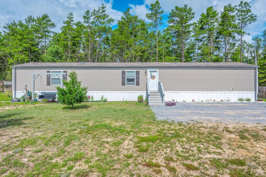 Welcome home to peaceful country living! This 2021 3 bed, 2 bath manufactured home sits on nearly an acre of quiet, open space. Inside, enjoy stainless steel appliances, built-in shelving, and an upgraded guest bath. The home includes an AC warranty and a transferable Vivint security system for peace of mind. Step outside to find three storage sheds and plenty of room to roam. A perfect blend of modern comfort and rural charm--don't miss this one!