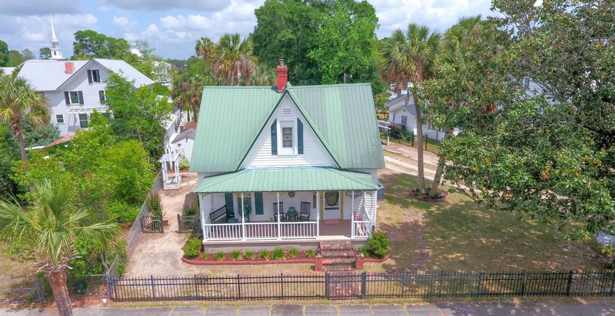 Beautiful Victorian home in the heart of the historic district & 1 block from Lake Defuniak. All the charm of an historic home, w/ all the modern amenities. Metal roof '05; New tankless water heater Dec '23' HVAC & duct work '15, Double-pane argon-filled windows (double-hung for easy clean); ext. window frames metal wrapped '15. Spacious eat-in kitchen w/lots of pantry space, granite countertops. Beautiful, original stain glass doors separate kitchen & formal dining. Stain glass window in 1st floor bath. Original hardwood floors; Fireplace in living room & master BR. Ext. features include 7x26 porch w/concrete floor; 16x24 back deck. Fenced on 3 sides w/over 100' high-quality aluminum fence & privacy fence at back. Property appraiser shows 1935 yr built, but home dates back to 1890.