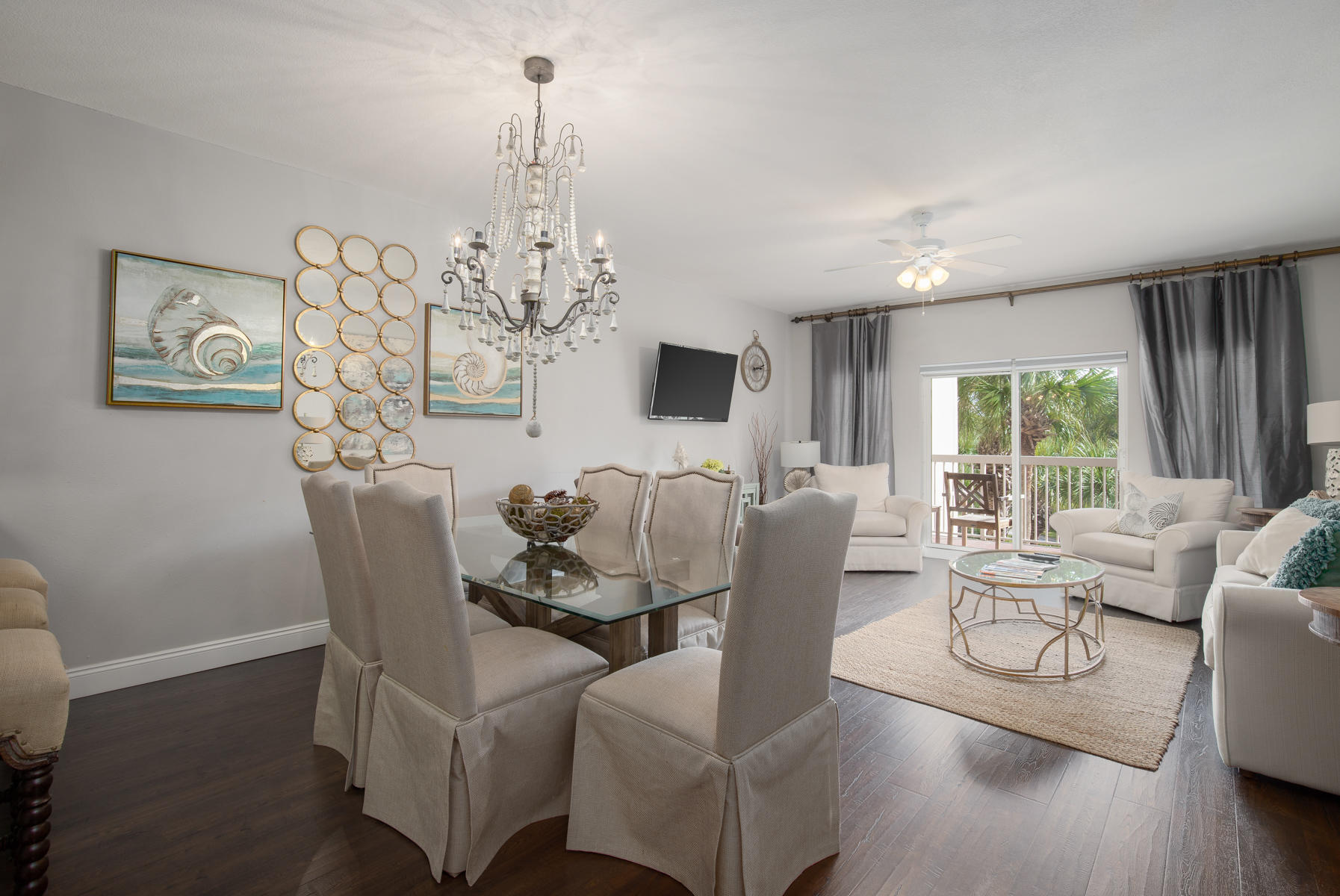 A serene retreat within the upscale Tops'l Beach and Racquet Resort, this immaculate 2BR/2BA condominium in the Summit at Tops'l has been beautifully renovated to offer a lifestyle of coastal elegance only a short stroll away from the beach. Find a calming neutral color palette highlighted by coveted finishes such as wood plank tile floors, tiled bathrooms, and a modern kitchen with granite countertops, custom cabinetry, a subway tile backsplash, and stainless-steel appliances. The open concept living and dining area opens to a covered balcony, has ample room for lounging, and a dedicated dining area plus seating at the breakfast bar. Both bedrooms are spacious with private ensuites. The Summit features a large, heated swimming pool with hot tub and grilling area. The private Top'sl resort is a gated community on over 52 acres with an award-winning tennis facility with lighted courts, three club pools, three onsite restaurants, a state-of-the-art fitness center, mini putt putt golf course, basketball court, conference center, and 600' of deeded beachfront. Centrally located in Miramar Beach near the Sandestin Golf and Beach Resort, Tops'l is convenient to shopping, dining, and attractions in both Destin and the 30A Beaches.
All information including dimensions is approximate and should be verified by buyer.