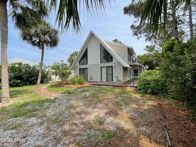 Two-story, 3 bedrooms, 2 bath, 1,908 square foot house features a great room and beamed open loft overlooking the living area. Property is less than two blocks away from the white sand beaches of the Gulf of Mexico and from the famous white sands and emerald- green gulf waters of Panama City Beach and a dedicated beach access. Located in a quiet, golf cart friendly, residential area of the desirable west end of PCB.