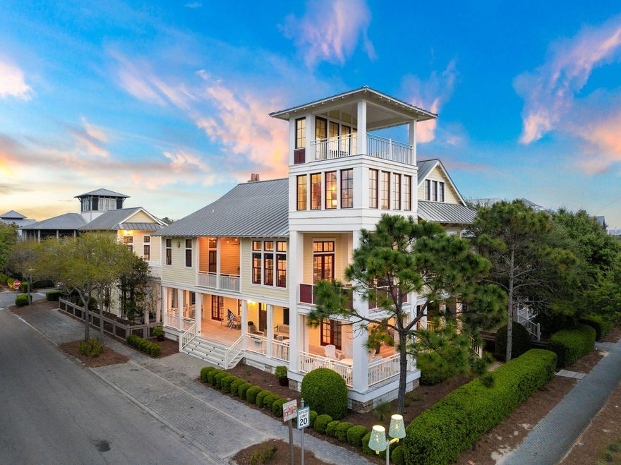 Located in the heart of WaterColor and designed by architect Dawn Thurber, this corner-lot residence offers multiple porches with Gulf views from its four-story watchtower. Positioned across from the WaterColor Beach Club, the home spans more than 5,000 square feet and includes seven bedrooms, a private pool, and a carriage house. Recent updates feature an additional third-floor bathroom, refreshed flooring, and upgraded lighting. Additional details include a central vacuum system and floor-to-ceiling impact glass windows.The main living and dining areas are located on the second floor, providing privacy and abundant natural light. The living room features soaring ceilings and French doors that open to generous covered outdoor spaces, creating seamless indoor-outdoor flow. A formal dining area and additional sitting spaces offer flexibility, while the kitchen is equipped with premium appliances, ample cabinetry, and a bar seating area.

Accommodations include suites on each floor and in the carriage house, along with a built-in bunk area. The private pool is positioned between the main house and carriage house, complemented by a wood-burning fireplace and outdoor kitchen.  A spacious mudroom includes custom built-ins, two sets of washers and dryers, and a changing room for convenient pool and beach access.

WaterColor offers a wide range of amenities, including a beach club, fitness center, town center, tennis and pickleball courts, walking and biking trails, and a boathouse with access to the lake for paddle boarding and kayaking. The community is also conveniently located just minutes from the dining and entertainment options along Scenic 30A. Inquire today to schedule a private showing and experience all that WaterColor has to offer.
