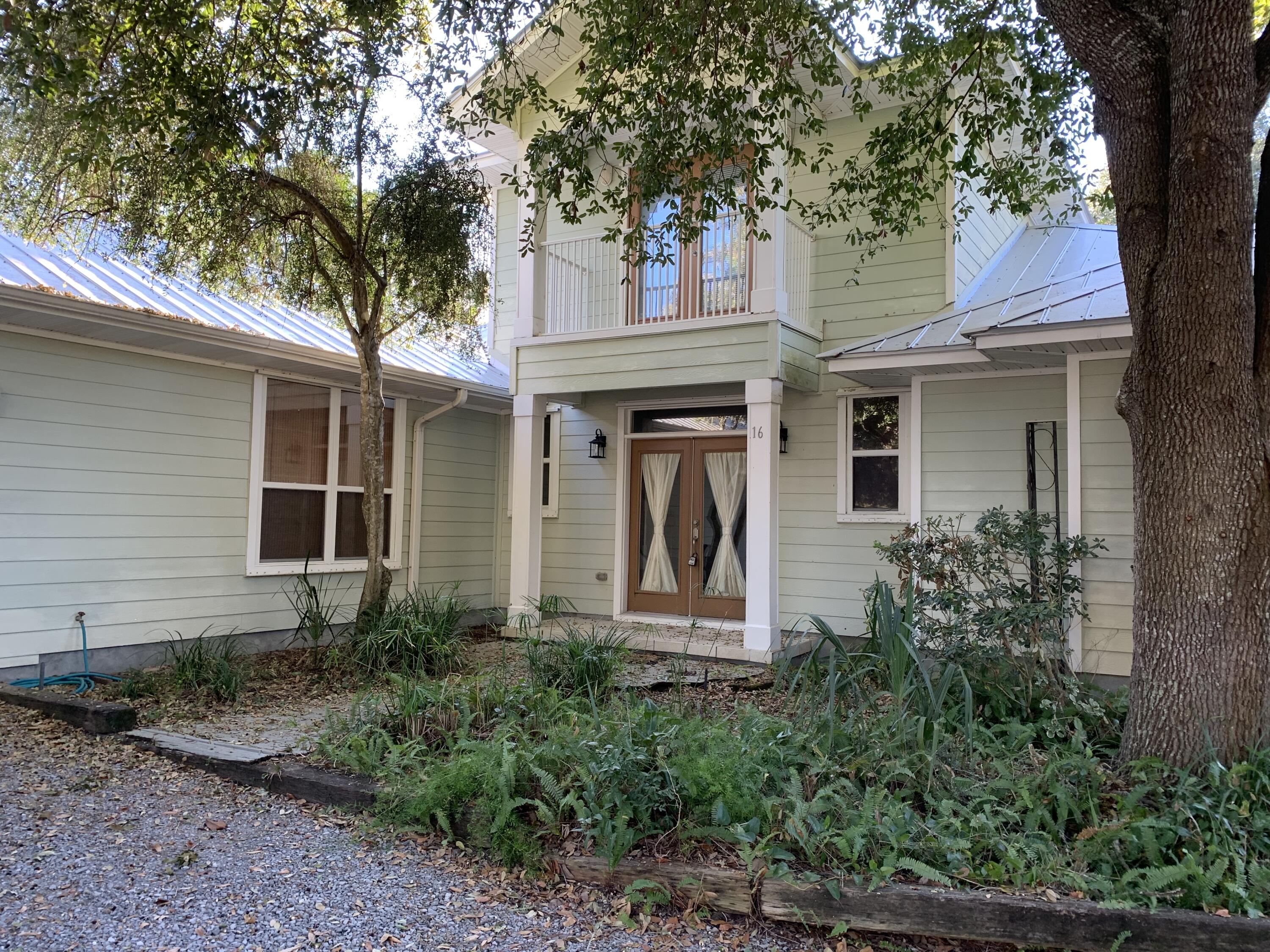 This lovely home in Santa Rosa Beach, Florida features three bedrooms and two and a half baths. The living areas are tiled and set in a spacious, open floor plan. Built-in bookcases, high, beamed ceilings and a gas fireplace are all beautiful extras that add wonderful charm to this home.The master bedroom, which includes walk-in closet, a master bath featuring a garden tub and seperate shower, is located on the first floor with two additional bedrooms upstairs. Each bedroom opens onto spacious decks with a screened porch. You will also enjoy the bonus room, located on the main level. This home is located just moments from the best entertainment and dining in the area and is also a short stroll to the beach. Pets allowed with a Non Refundable Pet Fee Per Pet (2)