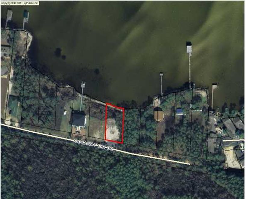 BANK OWNED Lot on the bay - Enjoy the tranquility and serenity of one of the last bayfront lots in this area. The views are unsurpassed in every direction! State preserves across the street offer the ultimate privacy. Just minutes away from Silver Sands Outlet Mall, Sandestin Resort, and all the amenities of the Emerald Coast. This property is being sold AS IS. All information is approximate and should be verified.