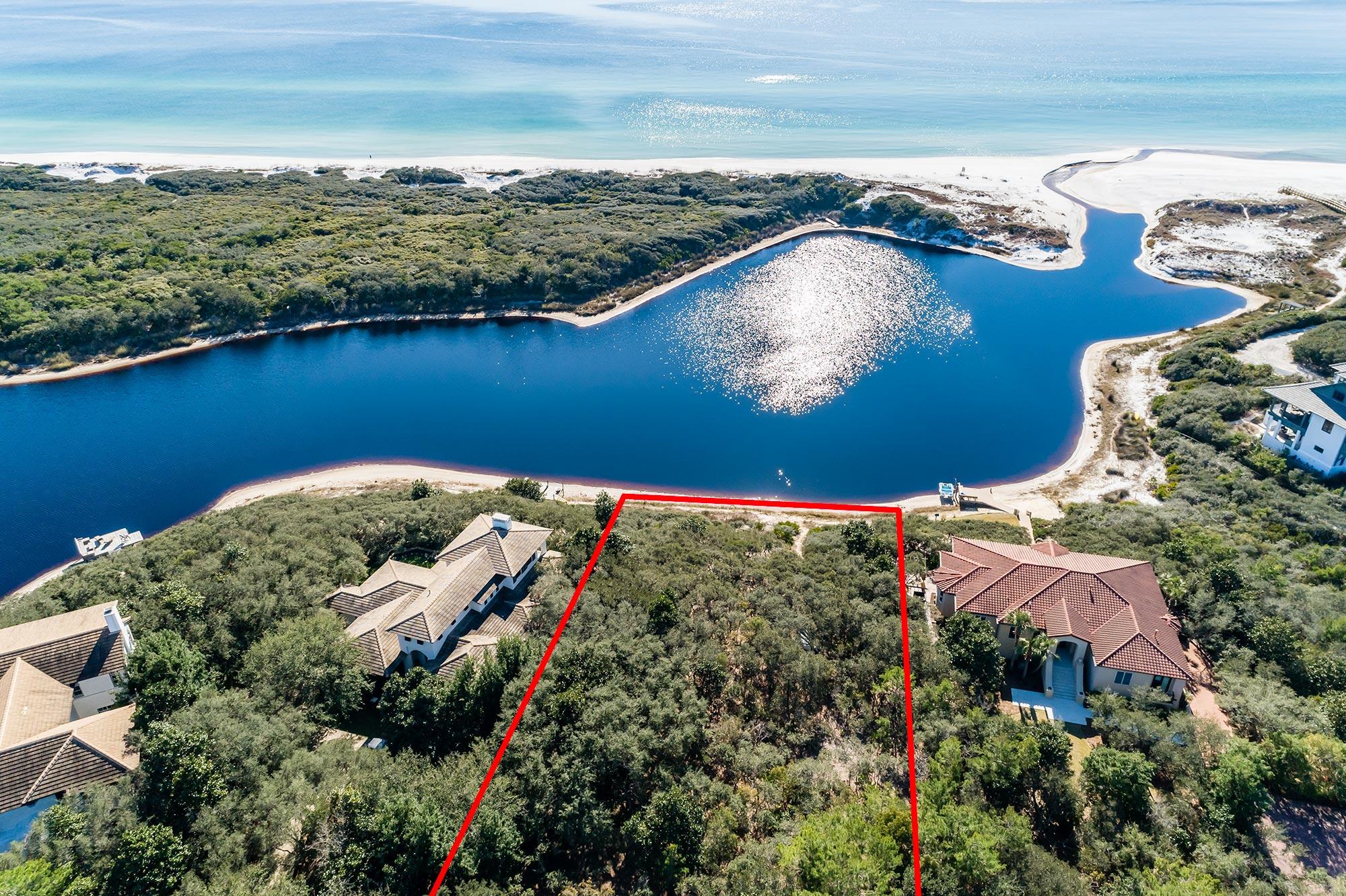 The last of its kind on 30A.Situated on a stunning lakefront location in the private, gated community of Redfish Lane sits this incredible and beautifully wooded homesite. It is approximately 30,927 square feet in size and offers a buildable area of approx 8,793 square feet; plenty of space to build your ideal abode. Boasting sweeping views of the Gulf of Mexico and Little Redfish Lake, providing the rare opportunity to create a breathtaking custom home on a coastal dune lake in a non-rental community. Favorably nestled between Grayton Beach and Blue Mountain Beach, the Community of Redfish Lane stays true to its Old Florida atmosphere with design codes assisting in the preservation of natural landscapes. Don't miss the chance to call this exclusive and intimate community ''home.''