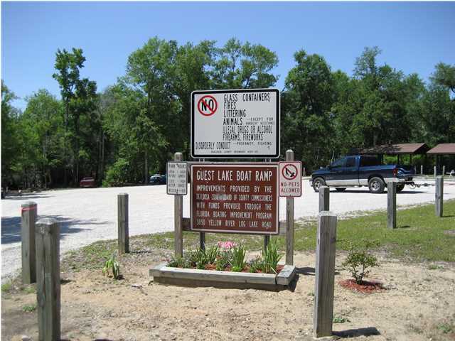 This wooded lot is located in the quaint community of Holt, Florida. Get away from the hustle and bustle of city life and enjoy this beautiful wooded lot. This property is close to the I-10 exit and close to the many amenities that this area has to offer. The property is close to the Yellow River where there is a public boat launch for you boating enthusiasts and is close to Blackwater River if you like to raft or canoe. The property is in a cul-de-sac. To best locate this property, take a copy of the aerial view on the MLS report. Buyer to verify all lot dimensions.