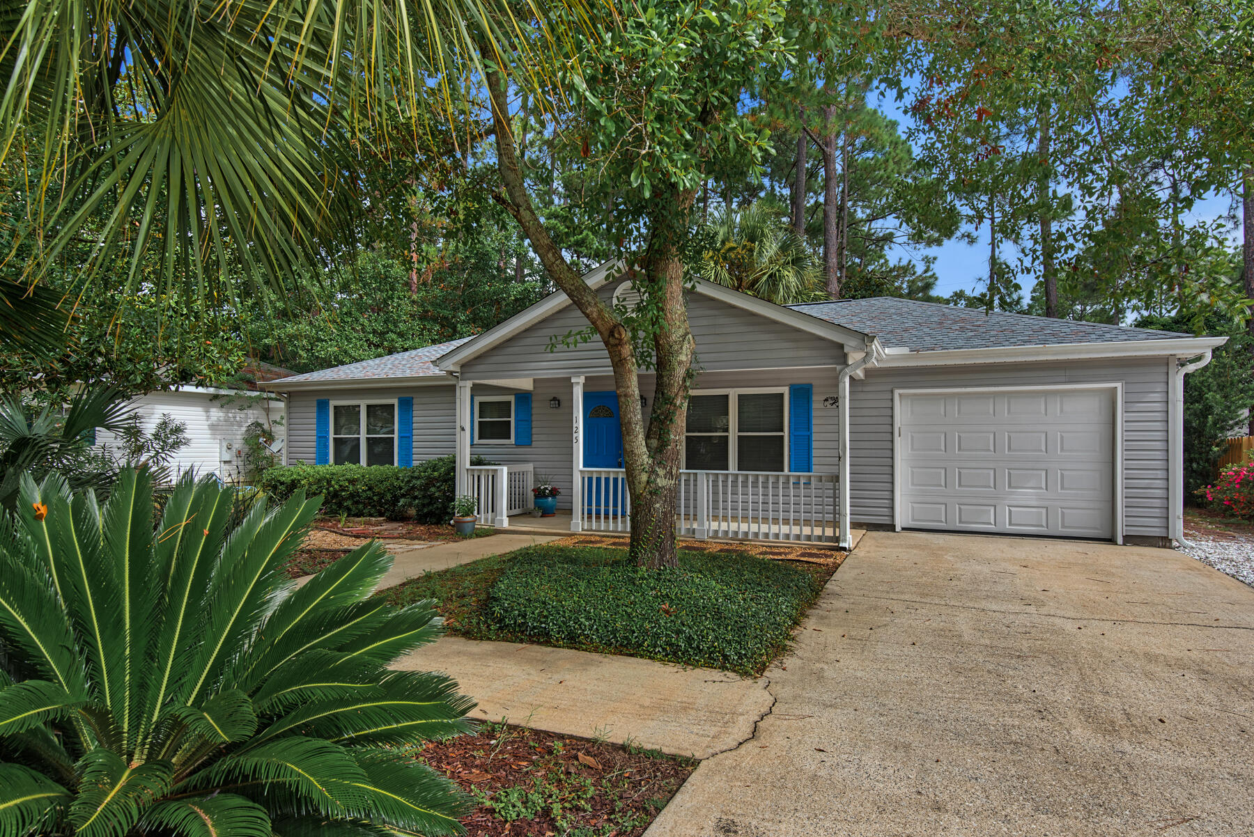 Sleek, modern home cradled in lush landscaping, with many recent upgrades of about $32,000. New roof March 2022, new air conditioner August 2022, new hot water heater April 2022, newly painted walls August 2022! New flooring August 2022! Vinyl plank in subtle colors adds to spacious feeling of living room with cathedral ceiling open to the kitchen. Granite counters and moveable granite center island for flexible arrangement. Master bedroom has large walk-in closet, and second bedroom has spacious closet, as well. Low maintenance yard with carefully selected plantings. Community pool. Set in a convivial neighborhood a couple of miles from the Gulf of Mexico beach on 30A and minutes to public boat ramp on Choctawhatchee Bay.
