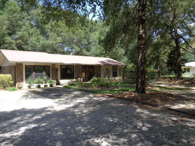 Country Living on a private one acre lot. Move-in-ready maintained to a high standard. Beautifully constructed sun room over looking the garden. Living room with two archway entrances and cathedral ceiling. Large third bedroom with bay windows could be converted to a office. Bedrooms are good size. Spacious kitchen and dinning area. Master bathroom with walk-in shower. Upgraded mental roof. If you are looking for a nice private property close to town you need to view this property.