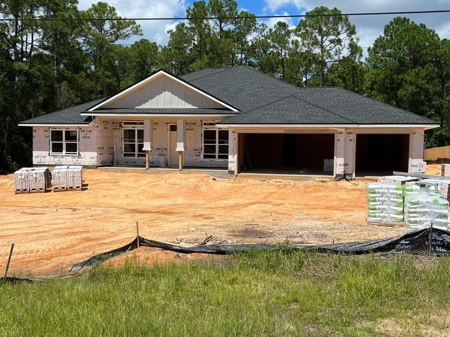 NEW Custom Built Home in Holley By The Sea,Enjoying all the Club House amenities including :Pools,Fully Equipped Gym,Tennis Courts,Waterfront Park & Deeded Access to Santa Rosa Sound This luxurious 4 bed/3 bath Tri split floor plan is under construction...and will be ready in time for your Spring '23 move in ~Desirable Location within HBTS..with easy access to Navarre Beach, shopping and Hwy 98 to Hurlburt Field AFB.This Stunning Robbins Builders Custom Home~offers trend setting design & features~Greeted by a walk in foyer open to the Formal Dining and Office with double glass doors/sweeping through to your open floor plan ~Large Gourmet kitchen enjoying shaker cabinets with crown molding beautiful granite counter tops~Tiled Back splash~ Under Mount Sink~S/S Appliances~ Large walk in pantry ~Center Island with open flow to the breakfast nook and family room, Wood Plank staggered tile through the foyer,dining room, main living area, laundry and bathrooms. Large Master with trey ceiling & ceiling fan. Master bath offers a large tiled walk in shower /separate soaking tub~Granite double vanity with picture frame mirrors & Huge walk in closet.Two additional bedrooms are a great size with ~ ceiling fans and Jack & Jill bathroom ~ step in tub/shower & WC with separate closet /vanity areas.Third additional bedroom is separate from the other rooms and would make a perfect guest/teen suite with its own bathroom and access out to the large covered porch.Laundry room & over sized 3 car garage ...ideal for the larger trucks and still plenty of room for all the outdoor toys. Home is situated on a large lot with grassed yard ~sprinkler system~ lawn pump and well with digital programmable timer for easy care. TAEXX in wall pest control system~ Fabric Shield Hurricane protection and dimensional shingle roof for lower insurance premium. Upgrades include crown molding, recessed lighting ,framed mirrors, deluxe lighting package,50 Gallon water heater, garage door remotes, attic drop down stairs~ to name a few......Call today for further information ,colors and construction status.** pictures are of a previously closed home so colors and fixtures may vary .