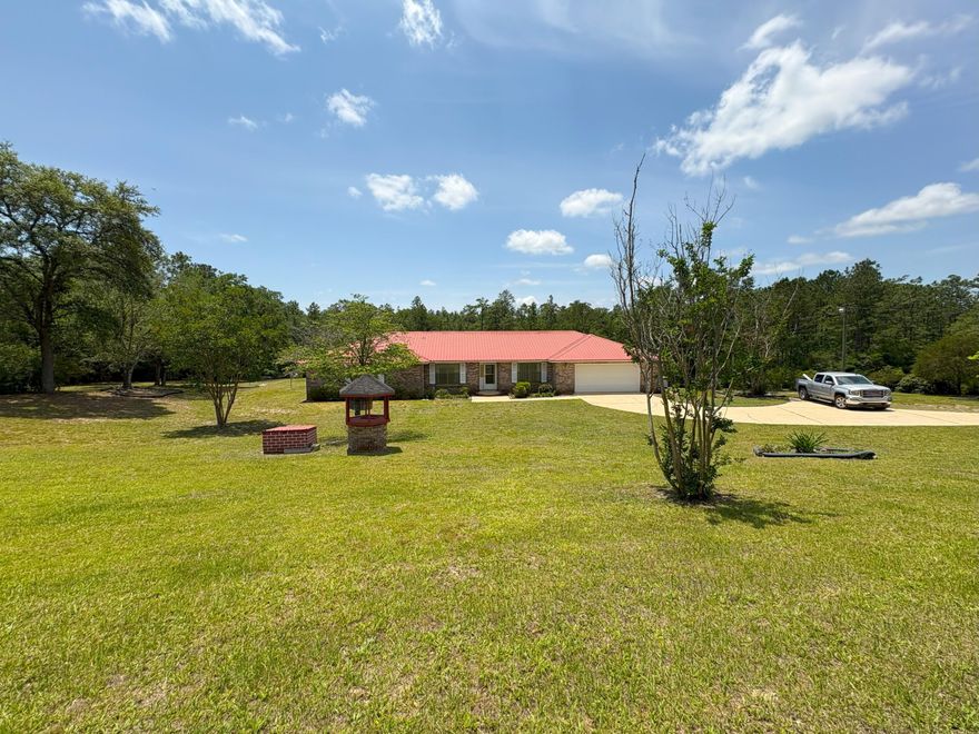 Have you dreamed of your own acreage with a nice home, an inground pool, a lake, a barn, and more, all for an affordable price? If you have, this could be the home of your dreams! This is a very nice, well-maintained home on just over 4 1/2 acres. It is completely fenced, comes with its own lake and docks, has an in-ground pool and spacious home. There is a 3-stall barn that has a work-out room, with equipment, that conveys with the property. It has water and power and there is room for horses or tractors or anything else you might want to store or raise here.There are several varieties of blueberry bushes on the property that will supply buckets of deliciousness for your family. There are also grape vines and gardening boxes for anyone wanting to test their green thumb! The whole parcel is watered by a sprinkler system with water supplied from your own lake. Inside the home you will find a huge family room with a corner fireplace, and a large master bedroom that walks out to the deck and pool. There are 3 full bathrooms here; one for each bedroom. The kitchen is a classic with solid wood cabinets, all the major appliances, breakfast bar and breakfast nook with great views of the pool and lake. There's also formal dining for those who enjoy that option. The laundry room is a nice size and comes with storage cabinets. The owner will leave extra freezers in the garage, all pool equipment will convey, and there are storm windows for the whole house. This property has so much to offer. It has been lovingly maintained for the last 25 years and will make someone an awesome home. Don't miss out! Schedule your viewing today! (There will be more interior photos available soon)