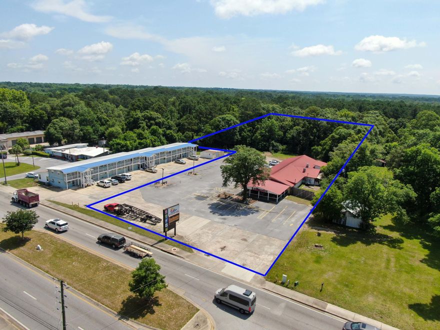 Incredible income-producing property on 3.79 acres with 160 front feet on Hwy 331S just 2/3 mile north of I-10. Currently leased to LaRumba's Restaurant. DeFuniak Springs is growing with the newest additions of Starbucks, Chick-fil-A, Bay Springs development and the upcoming development at the NW corner of I-10 and 331S. Building total SF is 6368sf with 5096sf heated & cooled. There are 2 large dining rooms, bar area, plus a huge almost 1100sf covered patio area for outside dining.  There is a large kitchen and prep room; . Kitchen equipment does not convey. Tenant is in a month to month lease currently. Owner will consider financing with appx 20% down and negotiable terms. This is one of only two commercial properties available on Hwy 331S currently with monthly income.