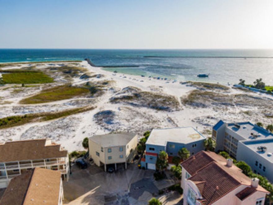 INCOMPARABLE, this property is located on the beautiful beaches of Destin with views of the Harbor pass and the Gulf.   No HOA fees for the building. Do you love to wake up watching the dolphins play and wind down the day watching a beautiful sunset over the Gulf?  If so, this is the place for you!   With a master with en suites on the first floor and a master with en suites on the third, it is ideal for extended families to spend time together but not be in each other's way.  This home will make a perfect place for a multiple family rental, a primary, or a second home. The property also comes with a washer and dryer included. If you are looking for an investment property, this is the place for you! This unit and the neighboring unit are both available, making this a unique multi-family rental!