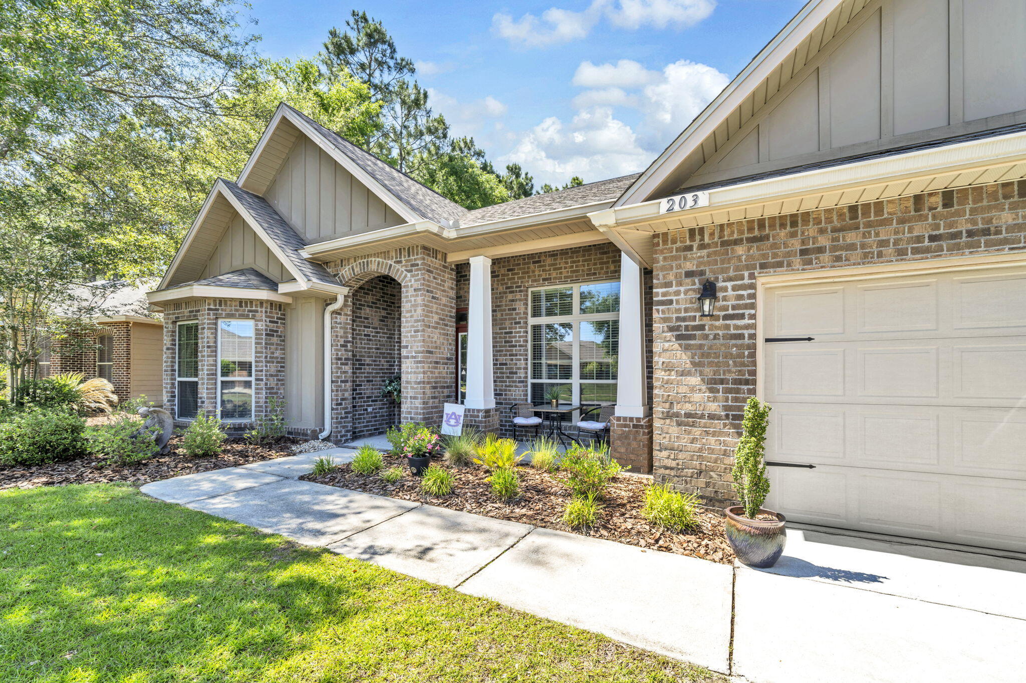 Florida charm meets modern comfort in this Craftsman-style 3BD/2BA + OFFICE home in Hammock Bay! Featuring real hardwood floors, elegant crown molding, and a spacious open layout, this home is both stylish and functional. The kitchen impresses with its granite countertops, gas range, stainless steel appliances, and large pantry. Step outside to your private retreat--lush landscaping with 9 palm trees, a paver patio, and fire pit perfect for entertaining. Dedicated office space is ideal for remote work or and additional bedroom. Located close to the new middle school and all of Hammock Bay's resort-style amenities, this home checks every box for comfort, convenience, and lifestyle. Don't miss it!