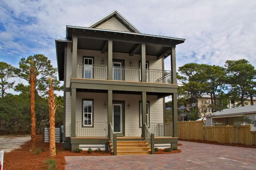 Stunning new custom construction tucked away on a quiet street in the heart of Seagrove Beach. Home is just off of Scenic Hwy 30A with quick beach access, a 25-mile bike path as well as unique shopping and dining. Casual luxury describes this finely built home full of glorious upgrades throughout. Open floor plan, huge windows, raised ceilings, top quality engineered wide panel oak floors, top of the line stainless steel appliances, recessed lighting, and builtin shelving are only a few of the unique quality features this home offers. The kitchen features beautiful custom cabinets, a gas stove, a large kitchen island and breakfast bar. There is a guest bedroom on the first floor along with a 1.5 baths and a large laundry room. On the second floor there is the master suite and 2 guest