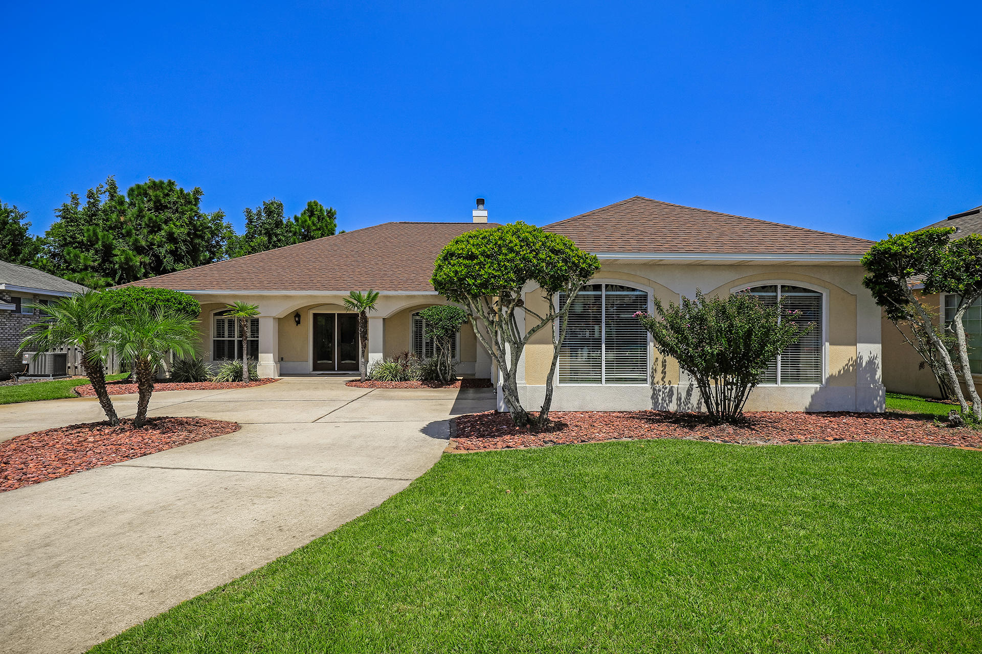 Location! One of the largest homes in Indian Lake. Well-kept home with new roof, large screened in patio, move-in ready. Gas and electric! Updated appliances! Quartz counter-tops. This is a custom built home with 2.5 baths were most have 2. Large master suite and 2 walk in closets with his and her vanities in master bath. Large circular driveway. Nine foot ceilings, security system, built in stereo speakers throughout and on patio, central vac, plantation shutters throughout, large laundry room, gas fireplace, large attic space above garage. Must see home with perfect location and great floorplan for you!