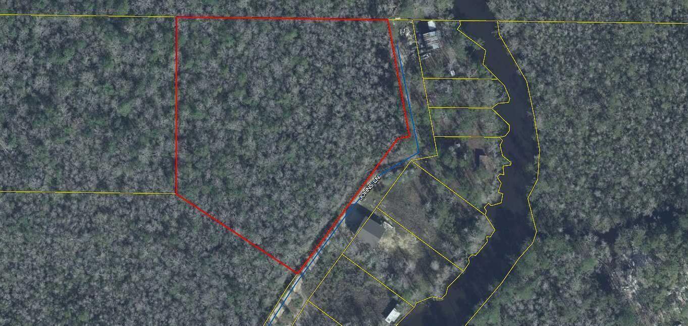 Here is your chance to own a beautiful 4.5 acres just across the street from Alaqua Creek! The back of the lot is bordered by Eglin AFB land, meaning there will not be any development on that side. Come see your new homesite today! Per Freeport Water, it will cost $1446.03 to have public water run to the lot. Public sewer is not available though, at this time, so septic would be needed. I have verified with Walton county that horses are allowed on the property.