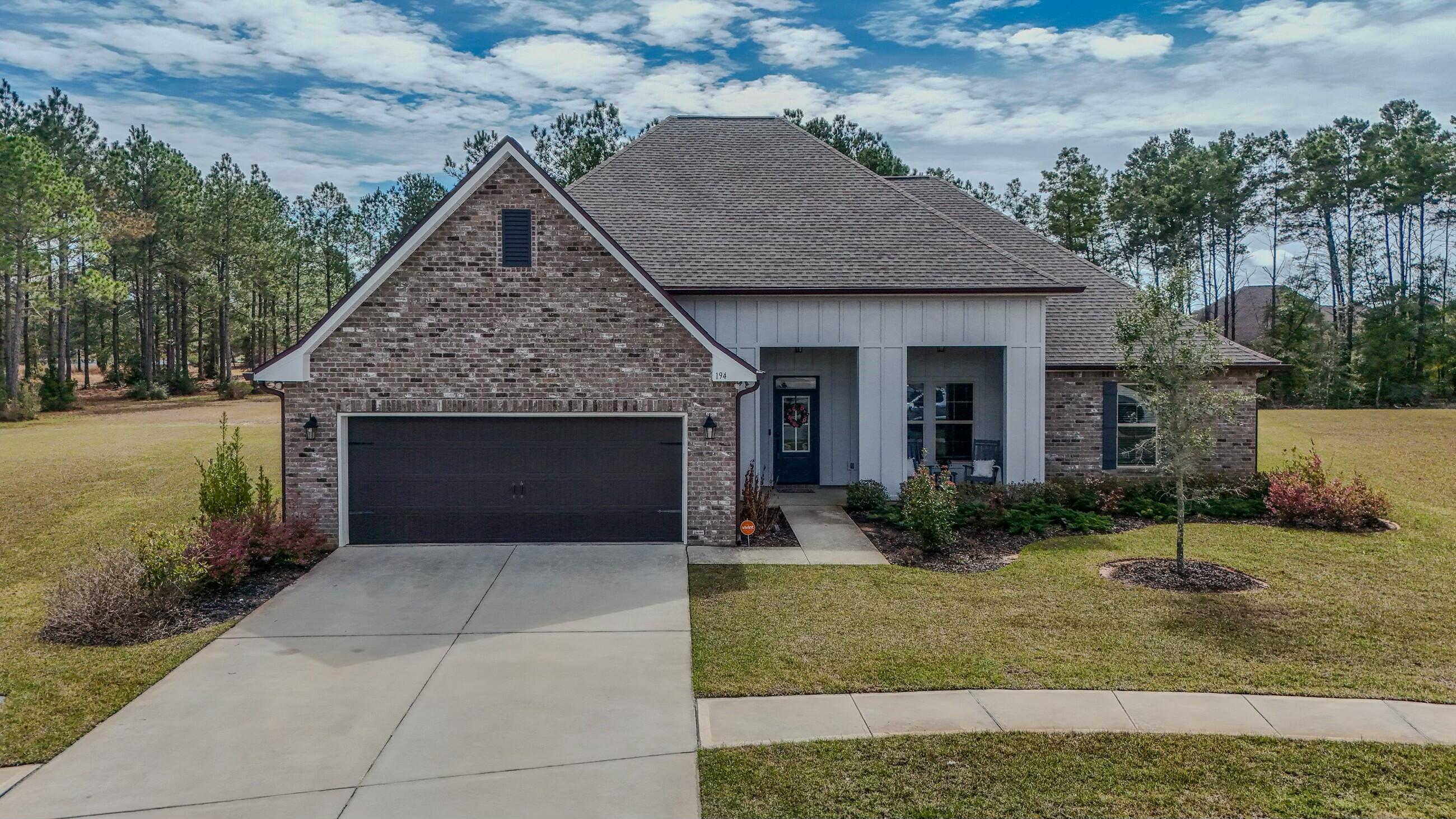 Welcome to 194 CAMPFIRE COVE in the TRAILS- 4 Beds, 3 full  Baths w 3010 sq' Living in this QUIET and SERENE neighborhood of Hammock Bay. Backs up to woods & wetlands with a peaceful and calmingview of the lake. Large pie-shaped yard totaling .41 acre. Oversized brick paver patio 7'x20' extends out from covered (and paved) Patio creating ample shade most of the day. Front covered porch for relaxing and watching the neighborhood world go by! GOURMET KITCHEN-hot water dispenser, quartz countertop/center island, gas range and over-sized walk-in pantry. Handy built-in desk in office, 12' ceiling in Great Room w gas fireplace and a Formal Dining Room. A Split layout floor plan- Main Bedroom has electric fireplace and Closest is OVERSIZED w convenient walk through to Laundry/Mudroom 3 Guest Bedrooms w walk-in closets, 2nd and 3rd bedrooms share a Jack & Jill bathroom.Flooring is wood-like ceramic tile throughout, carpet in bedrooms.
SO MUCH STORAGE in this house! EVERY bedroom has large walk-in  closets, 2 coat closets, Mudroom storage w a boot bench! 
ALSO INCL: blinds, gutters, tankless water heater, low E MI windows and VIVINT security System w cameras, doorbell and NEST thermostat and Gorilla Playset  
Hammock Bay Community includes: Lake Clubhouse w 3 Pools, 2 Gyms, Tennis, Pickleball, Basketball and two dog parks, walking trails 
PROPS Brewery And General Store, Big Screen TV in Town Center. New Dental Office.
GREAT COMMUNITY FOR ALL