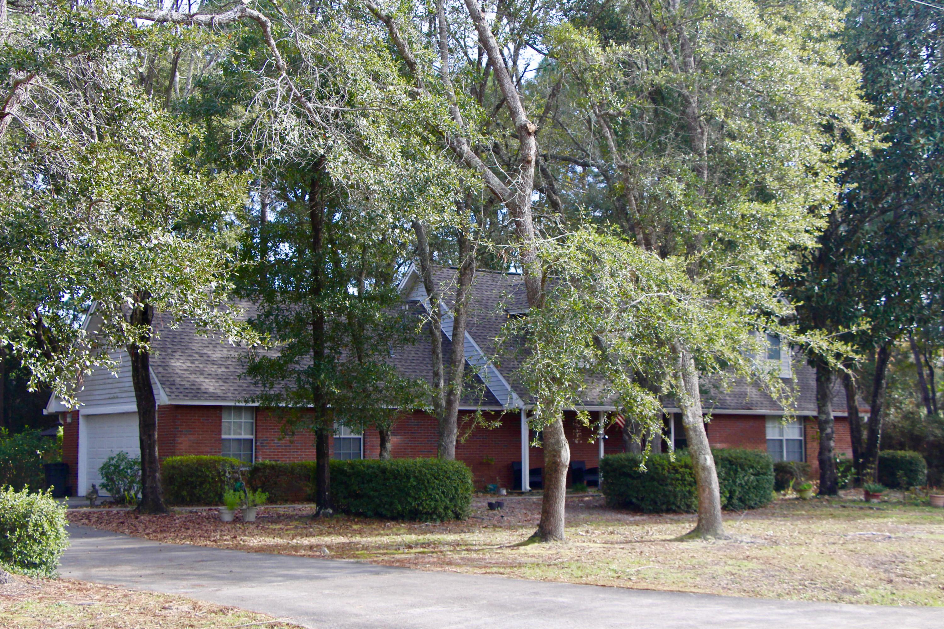 This is a rare find in town in Ft. Walton Beach........ a nice home on an almost acre treed lot, with a fenced back yard, and a 30X32 workshop/ garage that is ideal for storage and any hobby or craft activities imaginable. Featuring 3 bedrooms and 3 full baths, the home has carpeted, tile and hardwood floors. The hardwood floors have just been redone and they are stunning! While very close to town, the neighborhood has a very secluded and private feel and has no thru traffic. Most of the appliances have been upgraded or updated in the last few years: Dishwasher & microwave new in 2014, Refrigerator and stove new in 2016, Insinkerator (sink disposal) new in 2018, Tankless hot water heater new in 2015, New AC and mini-split in 2015, New plumbing throughout in 2017,.....