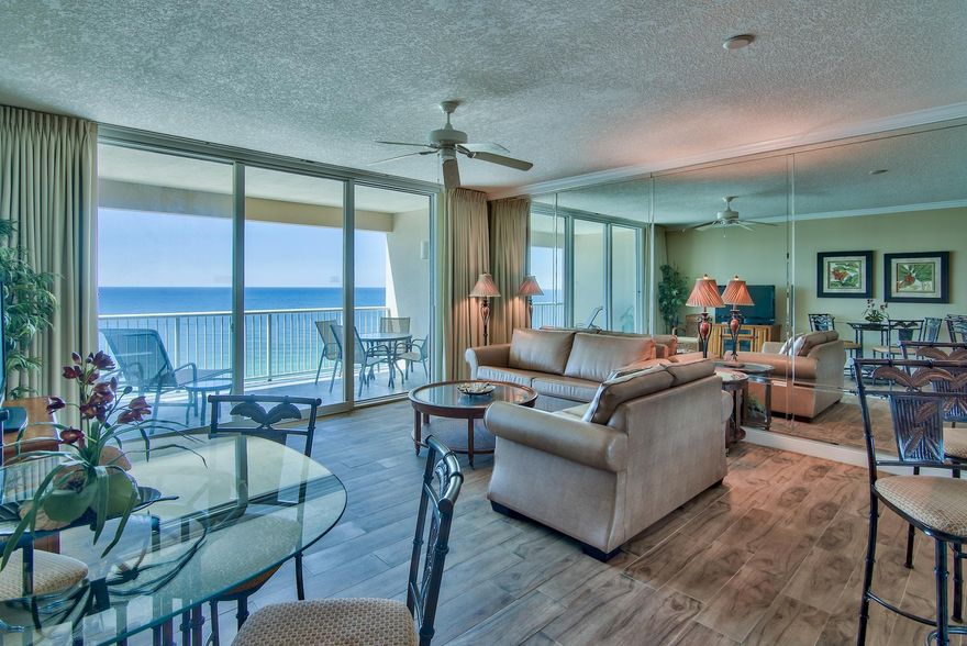 Paradise is waiting! Unit #905 is a beautifully updated fully furnished 1BR/2BA Gulf front unit with an additional bunk room. This floor plan is larger than most 1-bedroom units in Panama City Beach, totaling 1,026 square feet. This unit has been fully updated with wood plank and stone tile throughout, ideal for a beach condo - easy maintenance! The kitchen is updated with beautiful granite countertops & breakfast bar. The raised ceilings (9 ft.) & an open floor plan make this Gulf front condo feel especially spacious. Experience stunning views of the Gulf of Mexico from your balcony, living & dining area and kitchen. The private balcony offers incredible, unobstructed views up and down the coast! The master bedroom includes an en-suite bath, flat screen tv and king bed. Rental ready!
