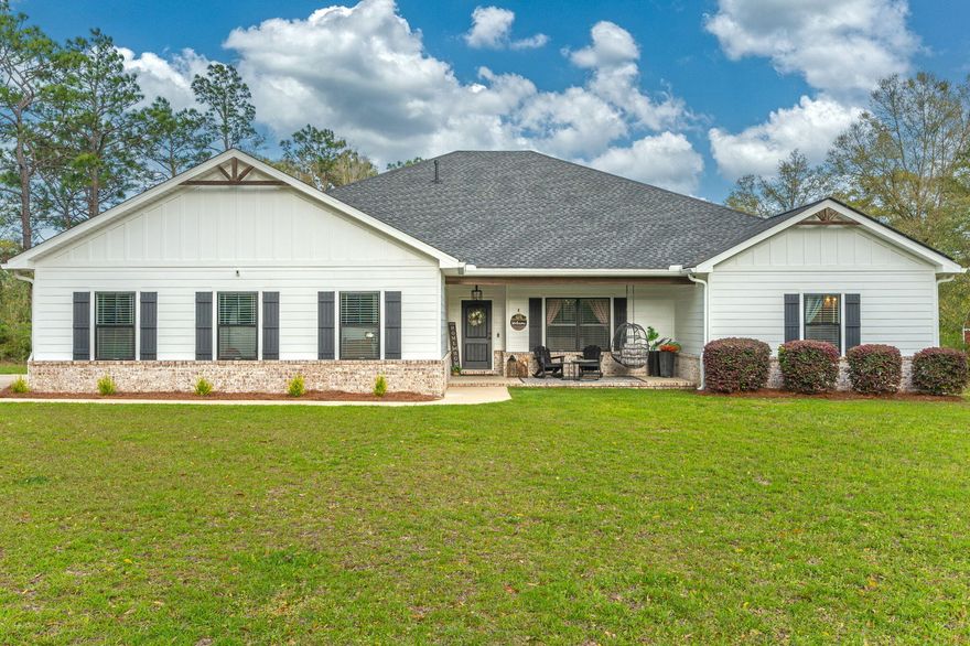 A true HIDDEN GEM with water frontage ... Check out this custom 5 bd/3.5 ba home nestled on nearly 2 1/2 acres in North Crestview! A serene setting as the home is tucked off the roadway and much of the property was left wooded and in a natural state. Inside you will find a large open floor plan w/ beautiful wood look tile flooring. Spacious living room and beautiful white kitchen w/ center island complete with all appliances including a wine fridge. Expansive master suite to accommodate all of your oversized furnishings! Master bath is a complete dream that you must see to truly appreciate. Luxuious soaking tub, tiled shower, dual vanity and spacious walk-in closet. Additional guest bedrooms are all a nice size with one of the bedrooms having it's own bathroom. Nice office space an