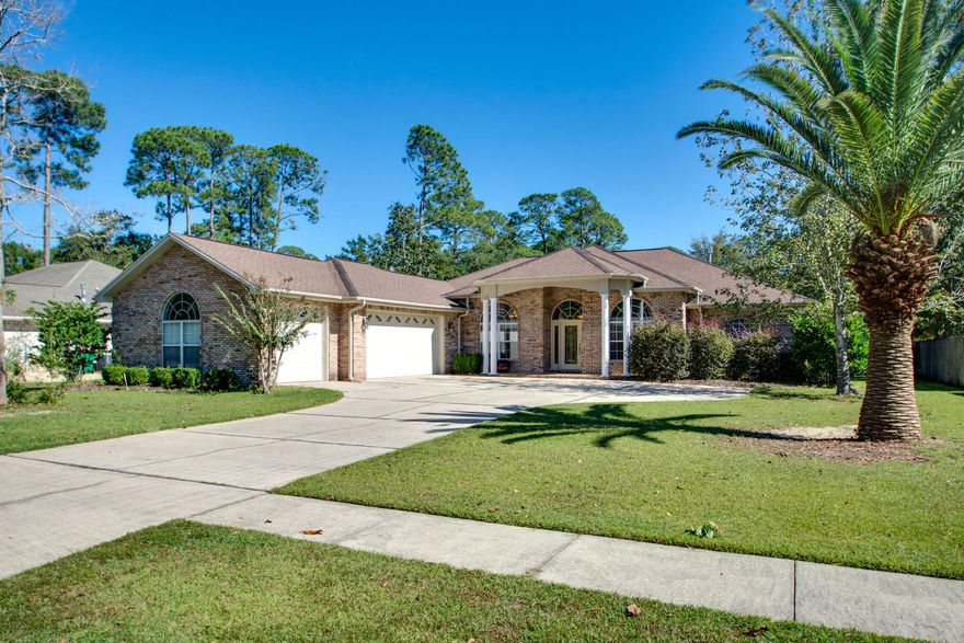 Welcome to this grand home on it's large lot with 11 ft ceilings and all its lovely finishing touches. Most rooms with trey ceilings, recessed lighting and crown moulding.This beauty has 3 bedrooms plus a flex room. Huge living area with custom built-ins and gas fireplace opens to a large Florida room. Expansive back yard is ready for the pool to be installed. Huge master suite with dual custom closets, separate vanities, walk in shower and oversize jetted tub.  The kitchen has tons of cabinet space and the dining area will fit your large hutch and buffet. Beyond the dining room is a powder room for your guests. For those of you looking for a 3 car garage this home not only has it but it is tastefully finished with it's epoxy floor, utility sink, storage areas and Tesla Red racing stripe!