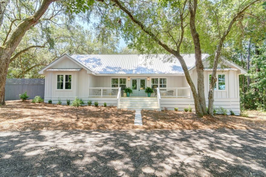 This modern farmhouse situated on a half acre lot with bay views is an amazing single family home with approximately 2,000 sq ft. Interior is beautifully renovated from the studs out, new board and batten siding, front and back decks and all new high impact windows - this house is like brand new! And an additional bonus of a huge garage for car or storage! New vaulted ceilings in the combined living, dining and kitchen area gives an open feel and plenty of room to entertain. You'll love the calming bay views from double windows and oversized front porch. Hardwood floors through out the house provides a great flow. Kitchen features stainless appliances including a built in microwave and hood vent, granite counters, farmhouse sink and a wine bar with beverage fridge. Premium cabinets with
