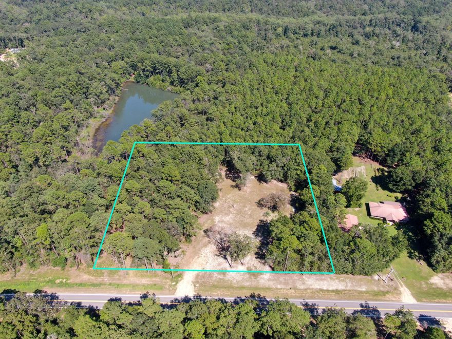 Almost 2 Acres totally ready for your new home! Having served as a homesite previously, this property has a middle portion cleared, with woods on 3 sides for privacy from neighbors. Paved road frontage less than 10 minutes to downtown DeFuniak. Deep well, electric and septic (not guaranteed). Large mature trees of all kinds.