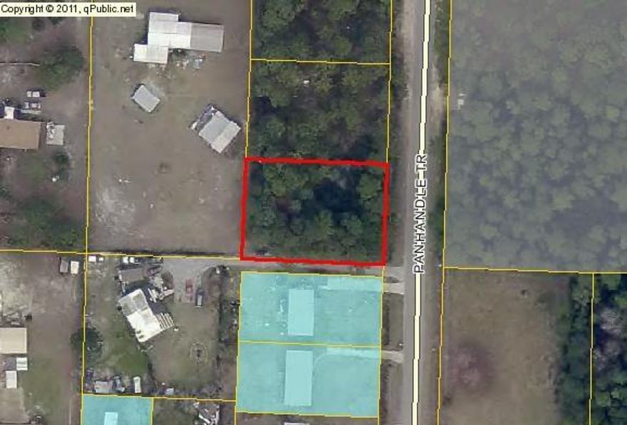 Wooded lot just minutes from beautiful Navarre beaches on the Gulf of Mexico. Great building lot with public water and public sewer already available. Zoning is RM1, Residential Mixed use. Mobile homes are allowed. The 2 lots to the North of this lot are also available.