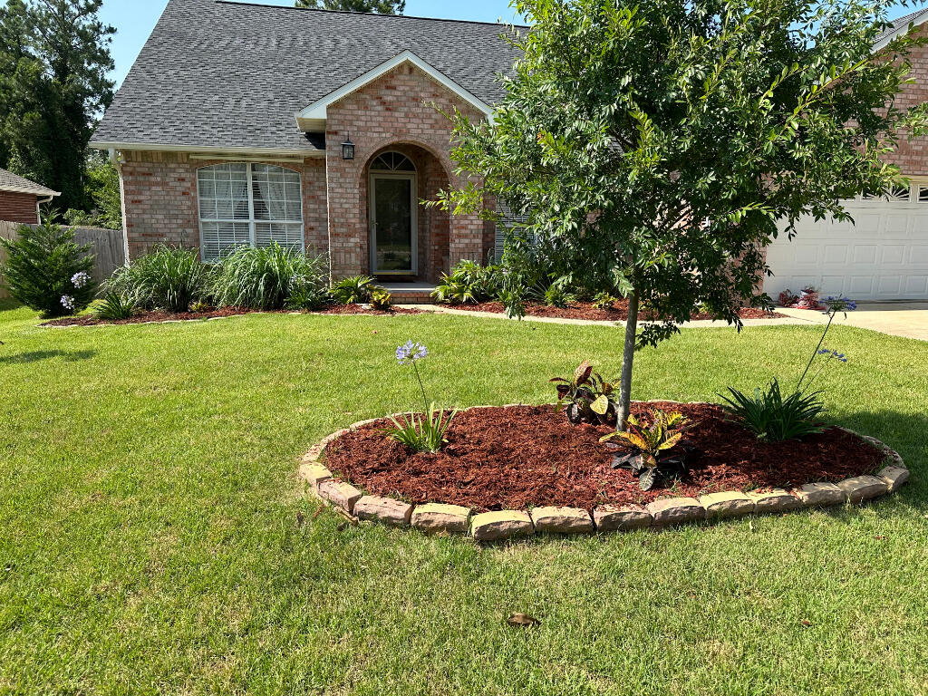 Brick Crown Pointe Gem offers 3 BR, 2 Full Baths, office or bonus room and 2 car attached garage. Split plan, open concept is perfect for entertaining. Kitchen counter with bar, screened sunroom, wood burning fireplace in family room. Fenced yard backing up to a natural preserve. Primary suite offers trey ceilings, walk in closet with in-wall safe. Primary bath offers double vanity, step-in shower, and jetted whirlpool tub. Many upgrades include newer roof, Generac full house generator, hurricane shutters, 2023 smart Carrier HVAC, irrigation system, fixtures, and more! A short drive to the beautiful Perdido Key beaches and eastern Alabama. Easy commute to downtown Pensacola and military bases, including NAS.