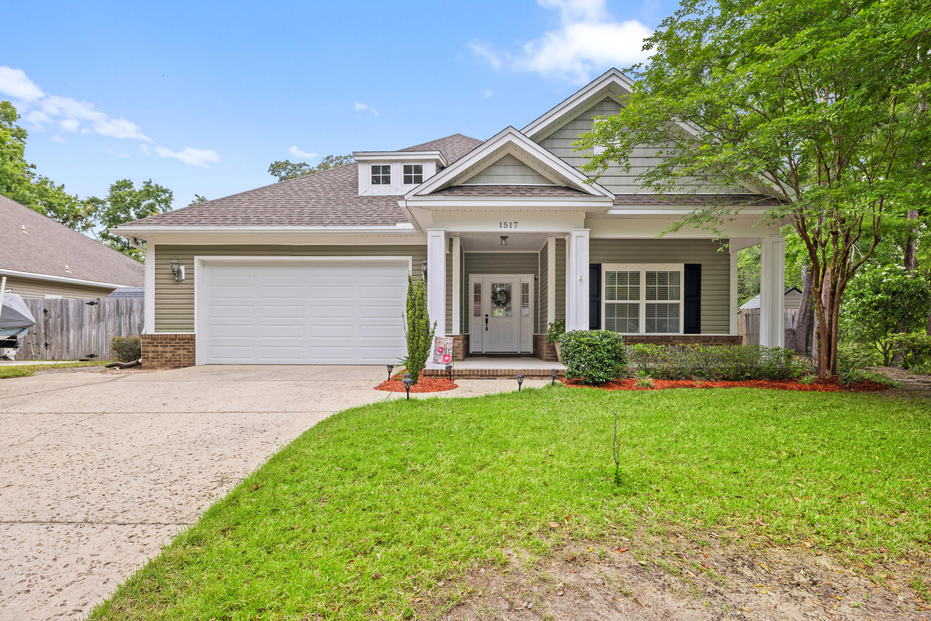 OPEN HOUSE SAT 5/17 10am-12pm Located in the heart of Niceville on just over a quarter of an acre corner lot, this 3-bedroom 2-bathroom Craftsman style home offers many extras and features a well-designed split bedroom floor plan that utilizes every bit of space perfectly. Beautiful mature landscape and an inviting large covered front porch will draw you right inside. After you move past the foyer, you'll find two spacious bedrooms, a quest bathroom as well as a separate office space that features French doors, plenty of built-in cabinet storage and a built in L-shaped desk. When entering the home through the garage, you'll be in the laundry room which includes a utility sink, tons of cabinets for extra storage, as well as convenient storage cubicles making this a perfect drop-off zone. The kitchen features white cabinetry, beautiful granite countertops, a large pantry, and an oversized island with plenty of eating space in the dining area. The kitchen is open to the dining and living room making it a perfect place for gathering. Located off the living room is the primary suite featuring a large walk-in closet, double vanities, a separate shower, and a soaker tub. You can use the French doors from the primary bedroom or the dining area to access an oversized covered lanai that spans the length of the house and is the perfect place to enjoy your morning coffee or entertain guests on the deck. The backyard offers so much privacy overlooking a wooded environmentally protected wildlife refuge and the space to add a double-gate for your boat or jet ski parking.
Additional features of this home include: 2023 Roof, 2022 Hot Water Heater, 2017 HVAC, oversized 2-car garage, irrigation system, crown molding, wood laminate flooring, Cat 6 connections to each room, hurricane shutters, additional washer/dryer hookup in the garage. Built by Randy Wise.