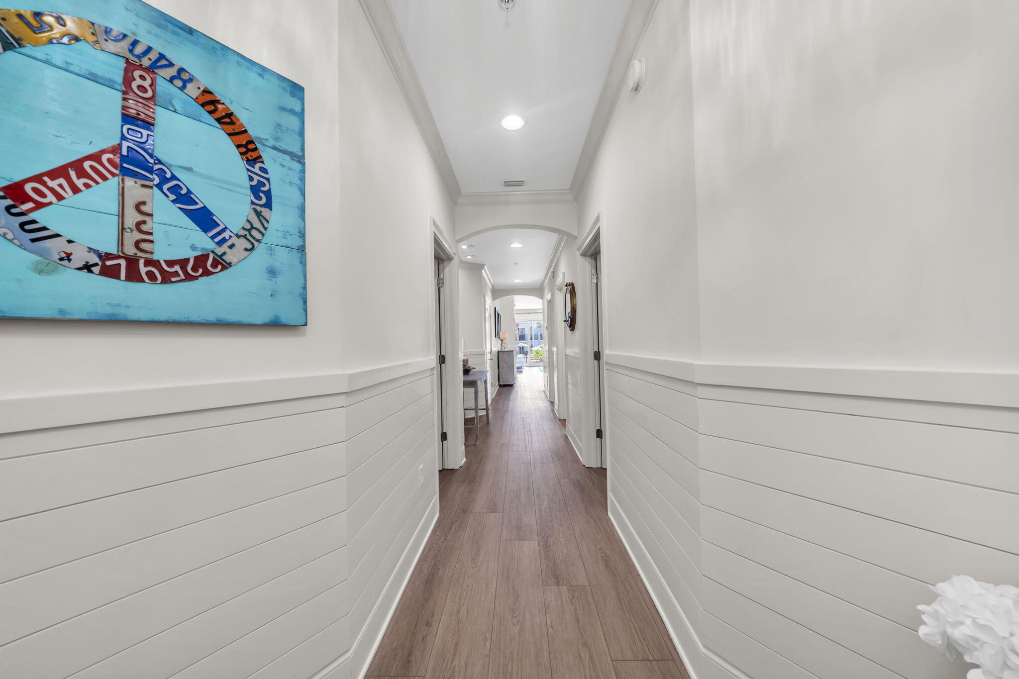 Step into coastal elegance at Adagio E103, a rare ground-floor Gulf-front residence in one of 30A's most sought-after luxury communities with $80K plus occured and on the books for 2025! This meticulously maintained 3-bedroom, 3-bath condo offers easy access and views of the pool AND is just steps from the sugar-white sands of The Gulf in Blue Mountain Beach. Inside, you'll find an open-concept layout with upscale finishes throughout, including luxury vinyl plank flooring, quartz countertops, and stainless steel appliances. The spacious master suite is complete with a Tempur-Pedic mattress and features balcony access, a spa-inspired ensuite bath with a soaking tub, double vanities, plus a separate shower decorated with magnificent tile. The entire condo was renovated last year from top to bottom which includes the kitchen, bathrooms, floors, tile, shiplap, all new furnishings, and a custom bunk room with individual TV's and charging stations- there is nothing left for the next owner to do! Enjoy outdoor living on your expansive patio - perfect for morning coffee or sunset cocktails. Adagio's resort-style amenities include a spectacular infinity-edge Gulf-front pool, a second 8,000-square-foot waterfall pool, hot tub, fitness center, and grilling areas, all in a gated, secure community. Whether you're seeking a primary residence, vacation retreat, or high-performing investment property, Adagio E103 offers the ultimate blend of luxury, location, and lifestyle.
