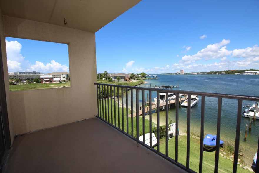 PRICE REDUCED FOR A QUICK SALE DON'T WAIT TOO LONG!! ENJOY EASY WATERFRONT LIVING IN THIS END UNIT WITH YOUR OWN DEEP WATER BOAT SLIP ON THE INTERCOASTAL WATERWAY! Pride of ownership shows throughout this wonderful condominium! Spacious living area soft designer colors, tile flooring throughout, built-in wet bar with cabinets and mirrored accent. Sliding glass doors that lead out to the large balcony and amazing sunsets in the summer evenings. Dining area opens into the living area making entertaining a breeze. Kitchen has lots of cabinets and counter space, large pantry and a laundry room. Wake up every morning to water views in your master bedroom with sitting area and separate access to balcony. Master bath has a walk-in closet and extended vanity. Generous additional