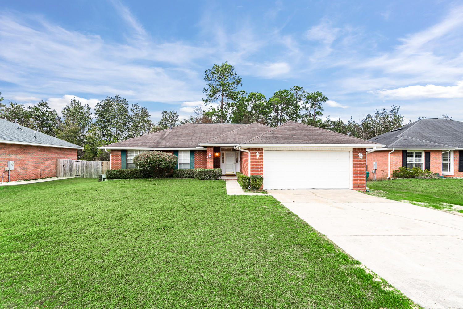 Updated all-brick charmer conveniently located south of I-10! The open floorplan along with the cathedral ceiling and great natural light give this home a spacious and inviting feel - great for entertaining! New flooring and fresh paint throughout. Spend cozy evenings by the gas fireplace with custom tile hearth. Kitchen features include a breakfast bar and lots of cabinets and counter space! Spacious master bedroom. Master bathroom includes garden tub, double vanity, separate water closet, and large walk-in closet with custom built-in shelving. Two additional bedrooms and split floorplan for added privacy. Fully fenced backyard includes a deck and additional patio space. Outbuilding and attic mean tons of storage space. This home won't last long, so call today to take a look