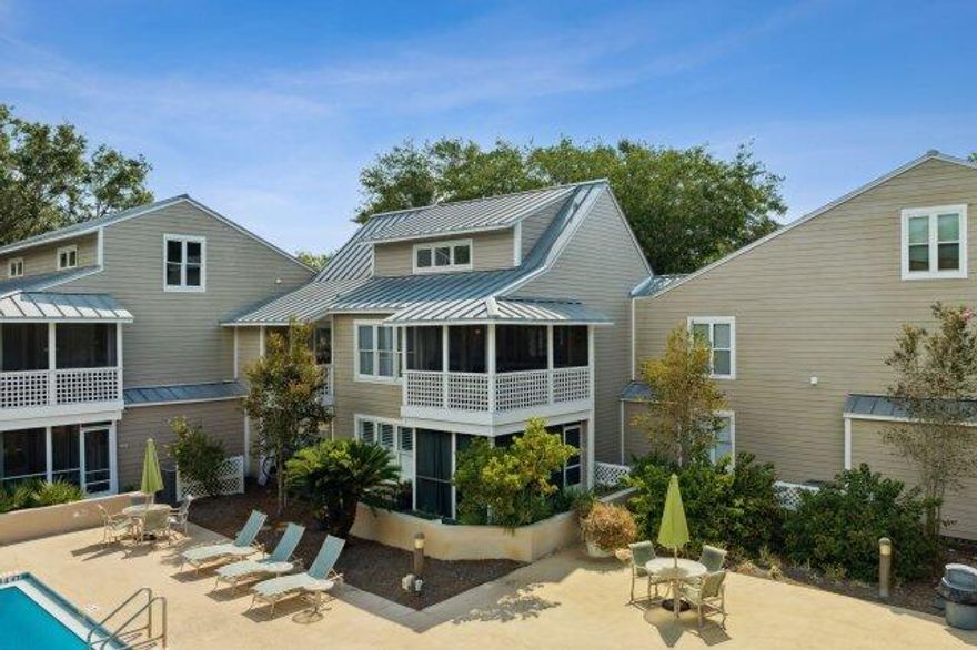 ATTENTION INVESTORS! 50k PRICE REDUCED...& RENTAL PROJECTIONS OF OVER 50K!  Best Priced Listing In All Of Hidden Dunes. This charming three-bedroom, two-bathroom beach house on the second floor provides a picturesque view of the resort's main swimming pool. The large living area features high ceilings and connects seamlessly to a screened porch. Furnished with a spacious flat-screen TV, DVD player, and new furnishings, the living room offers comfort and entertainment. The updated kitchen boasts stainless steel appliances, a granite countertop with bar stools for casual dining. The master bedroom on the first floor includes an attached bathroom and a king-sized bed, with a private screened porch overlooking the pool. The first guest bedroom features a queen-sized bed, while another another guest bathroom is conveniently located on the main floor. A spiral staircase leads up to a loft where a second guest bedroom with two twin beds awaits. For additional guests, a sleeper sofa is available in the living room. Hidden Dunes Beach & Tennis Resort provides a range of amenities such as a serene lake with a fishing pier, a horseshoe pit, a basketball court, top-notch tennis facilities, and outdoor grills for barbecues.