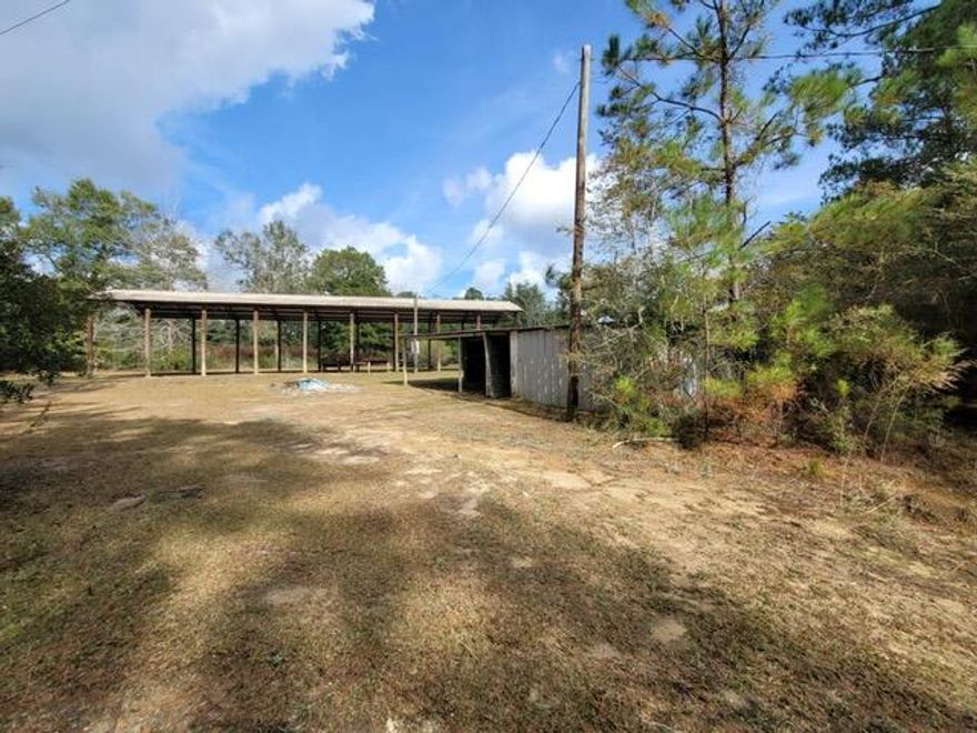 CASH SALE OR CONV LOAN ONLY SALE, AS IS.; 2 ACRE PARCEL with Pole Barn with Metal Roof and Shed. Previous Mobile Home on property which means Septic Tank on property, County Water (City of Laurel Hill), & Electric. Buyer to due own Due Diligence for use. Zoned: Single Family Residence (SFR) and Flood Zone X.